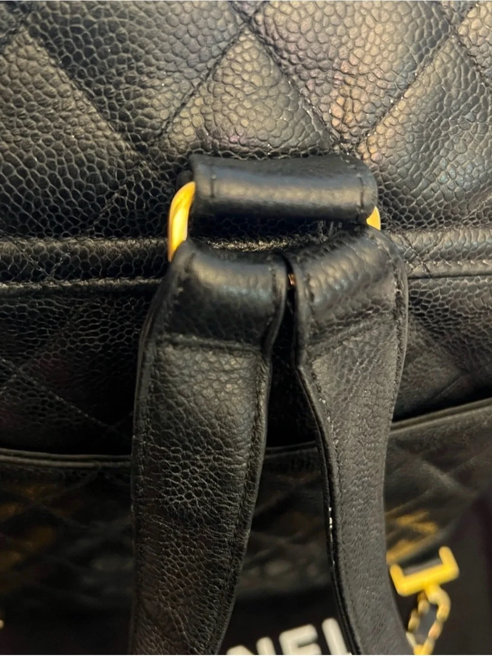 CHANEL Black Quilted Leather Backpack with Gold CC Accent